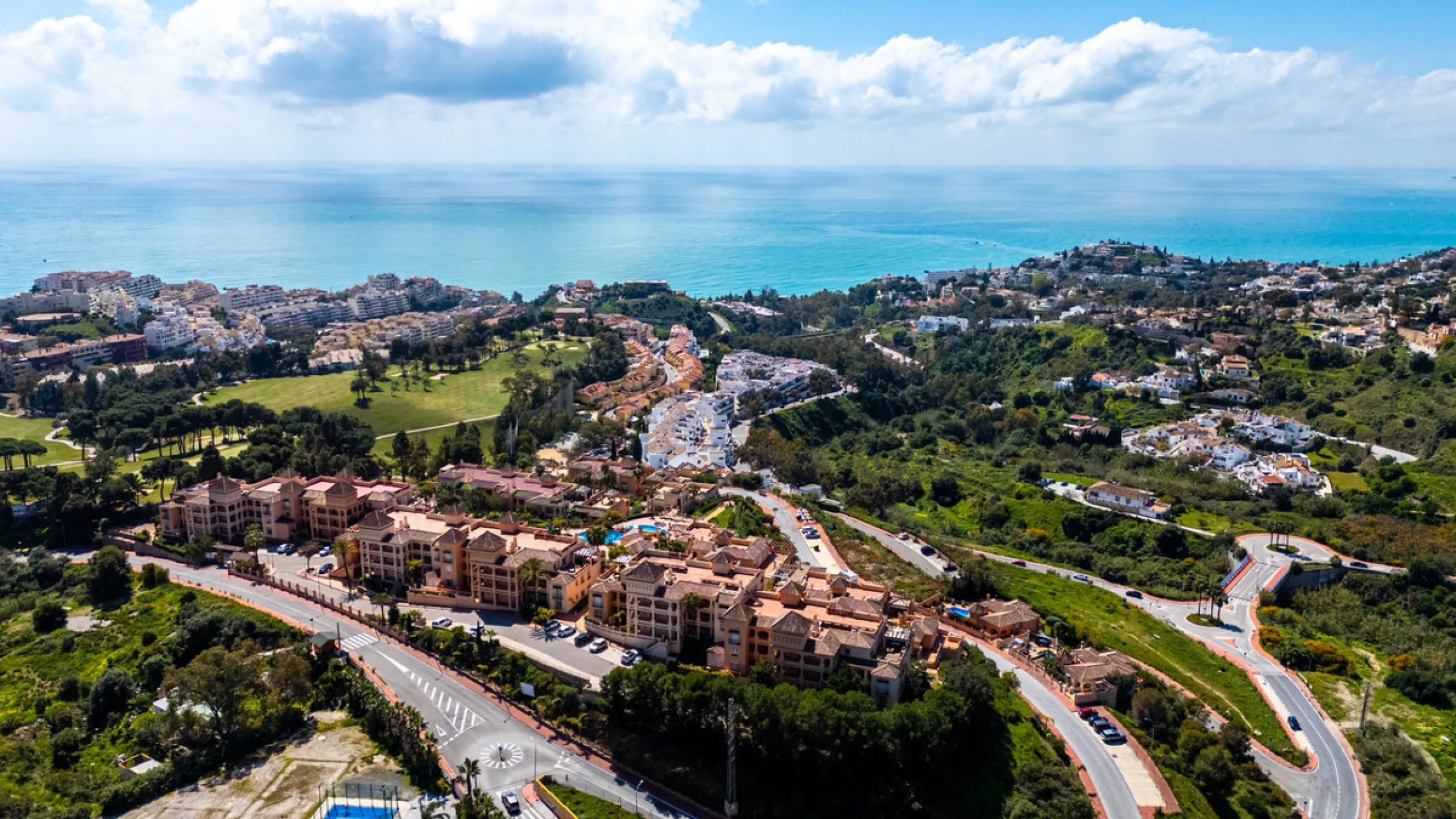This penthouse is a 2 bedroom 2 bathroom duplex penthouse just 1 km from the beach. The home features open plan living spaces with bright interiors and large terrace windows. The kitchen overlooks the lounge and dining area through an elegant archway. The