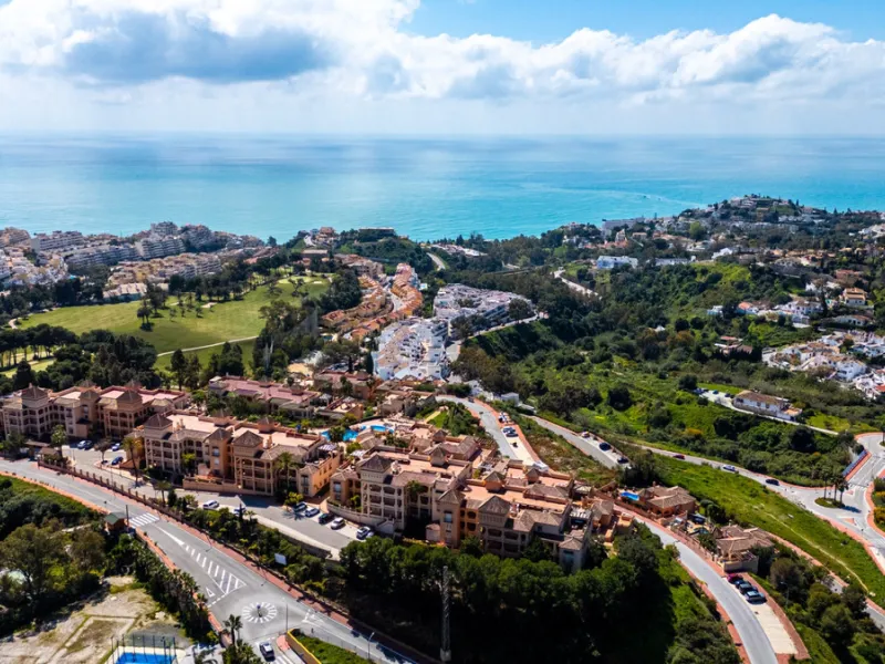 This penthouse is a 2 bedroom 2 bathroom duplex penthouse just 1 km from the beach. The home features open plan living spaces with bright interiors and large terrace windows. The kitchen overlooks the lounge and dining area through an elegant archway. The