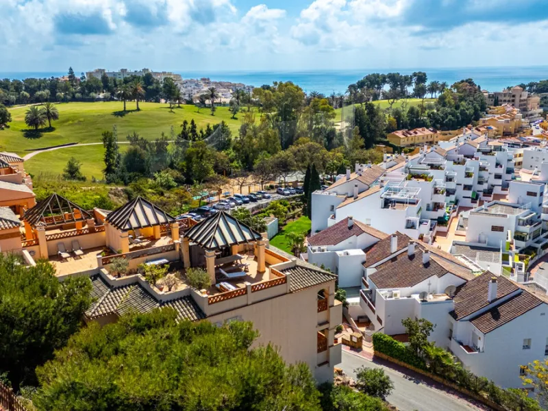 This penthouse is a 2 bedroom 2 bathroom duplex penthouse just 1 km from the beach. The home features open plan living spaces with bright interiors and large terrace windows. The kitchen overlooks the lounge and dining area through an elegant archway. The