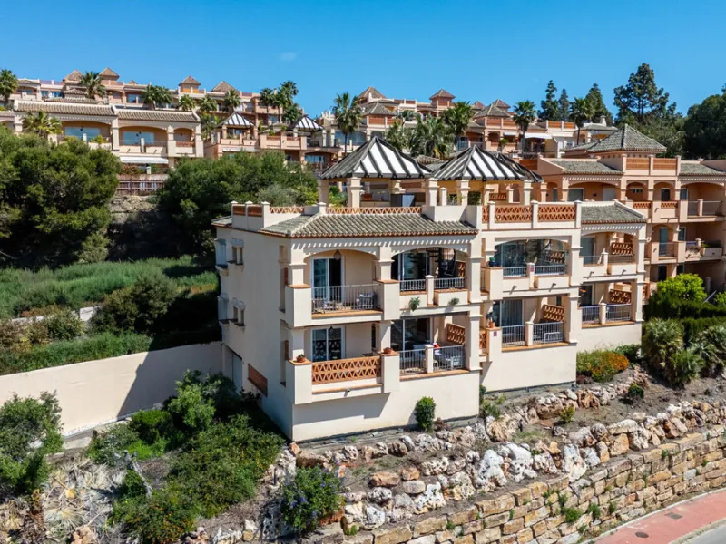 This penthouse is a 2 bedroom 2 bathroom duplex penthouse just 1 km from the beach. The home features open plan living spaces with bright interiors and large terrace windows. The kitchen overlooks the lounge and dining area through an elegant archway. The