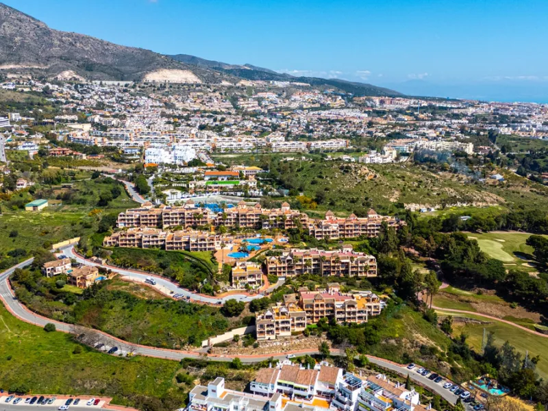 This penthouse is a 2 bedroom 2 bathroom duplex penthouse just 1 km from the beach. The home features open plan living spaces with bright interiors and large terrace windows. The kitchen overlooks the lounge and dining area through an elegant archway. The