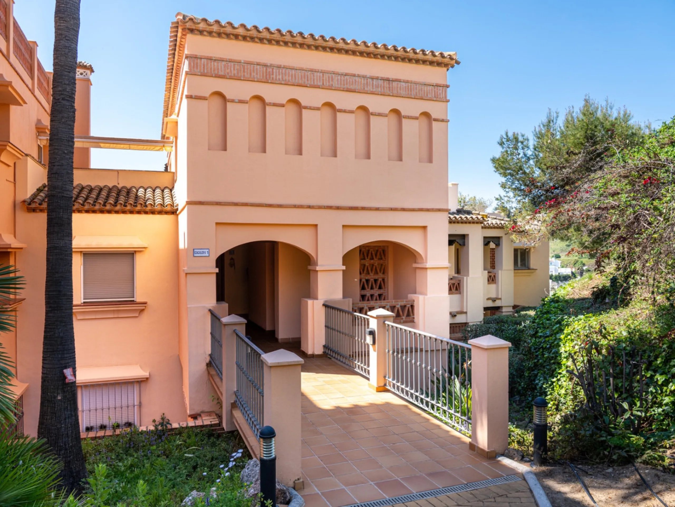 This penthouse is a 2 bedroom 2 bathroom duplex penthouse just 1 km from the beach. The home features open plan living spaces with bright interiors and large terrace windows. The kitchen overlooks the lounge and dining area through an elegant archway. The