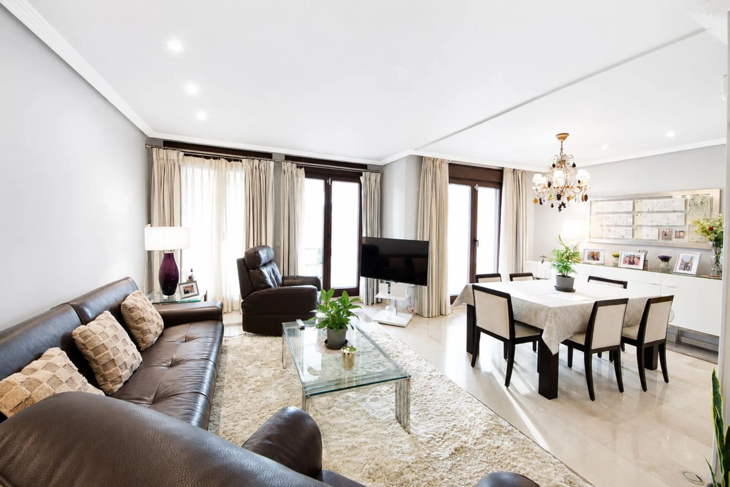 Ground floor apartment with private garden, open views, and 4 communal swimming pools.
