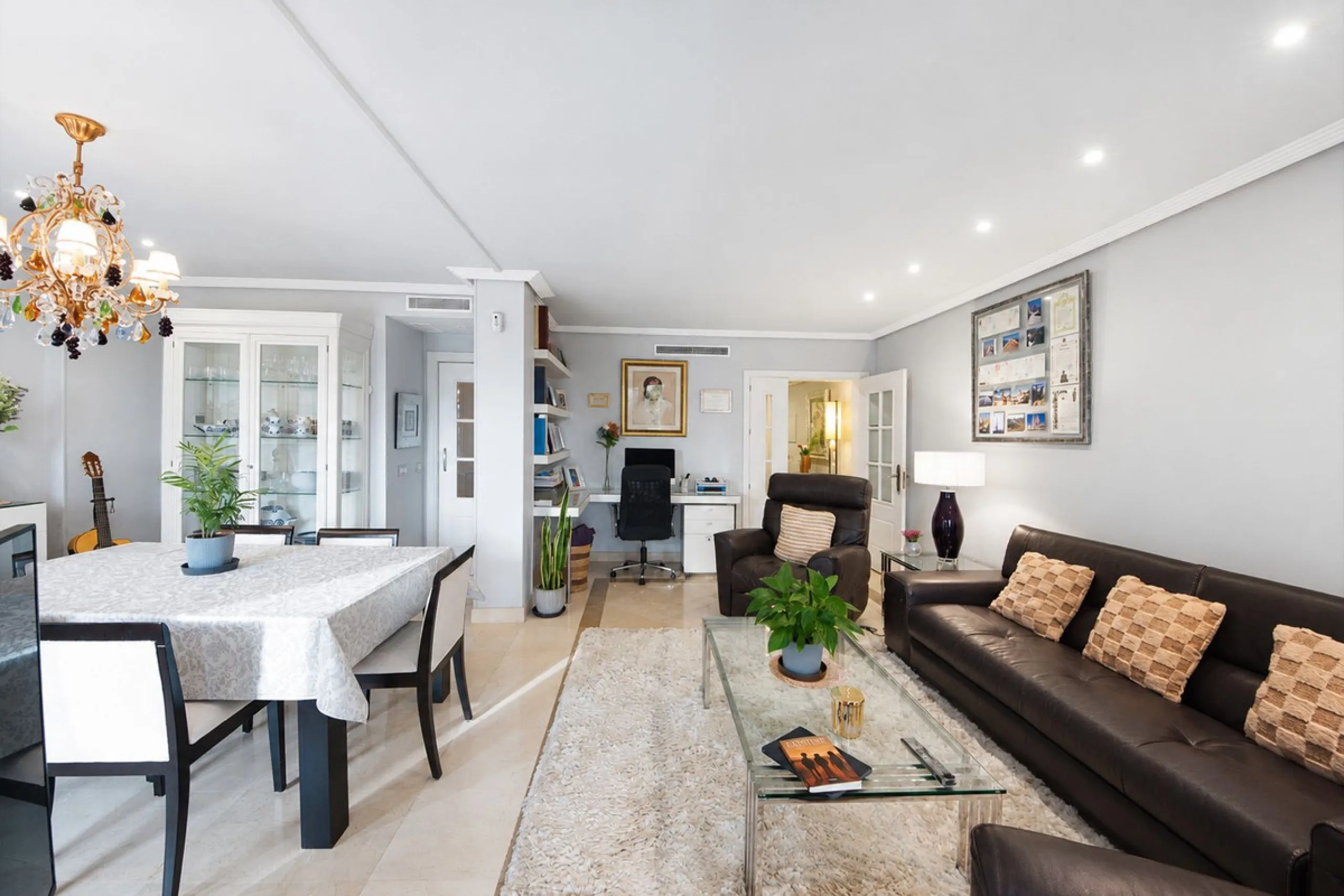 Ground floor apartment with private garden, open views, and 4 communal swimming pools.