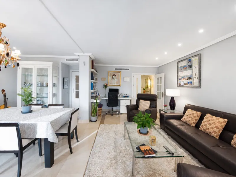 Ground floor apartment with private garden, open views, and 4 communal swimming pools.
