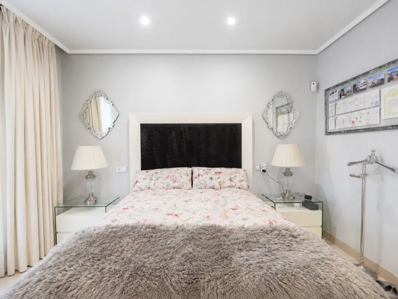 Ground floor apartment with private garden, open views, and 4 communal swimming pools.