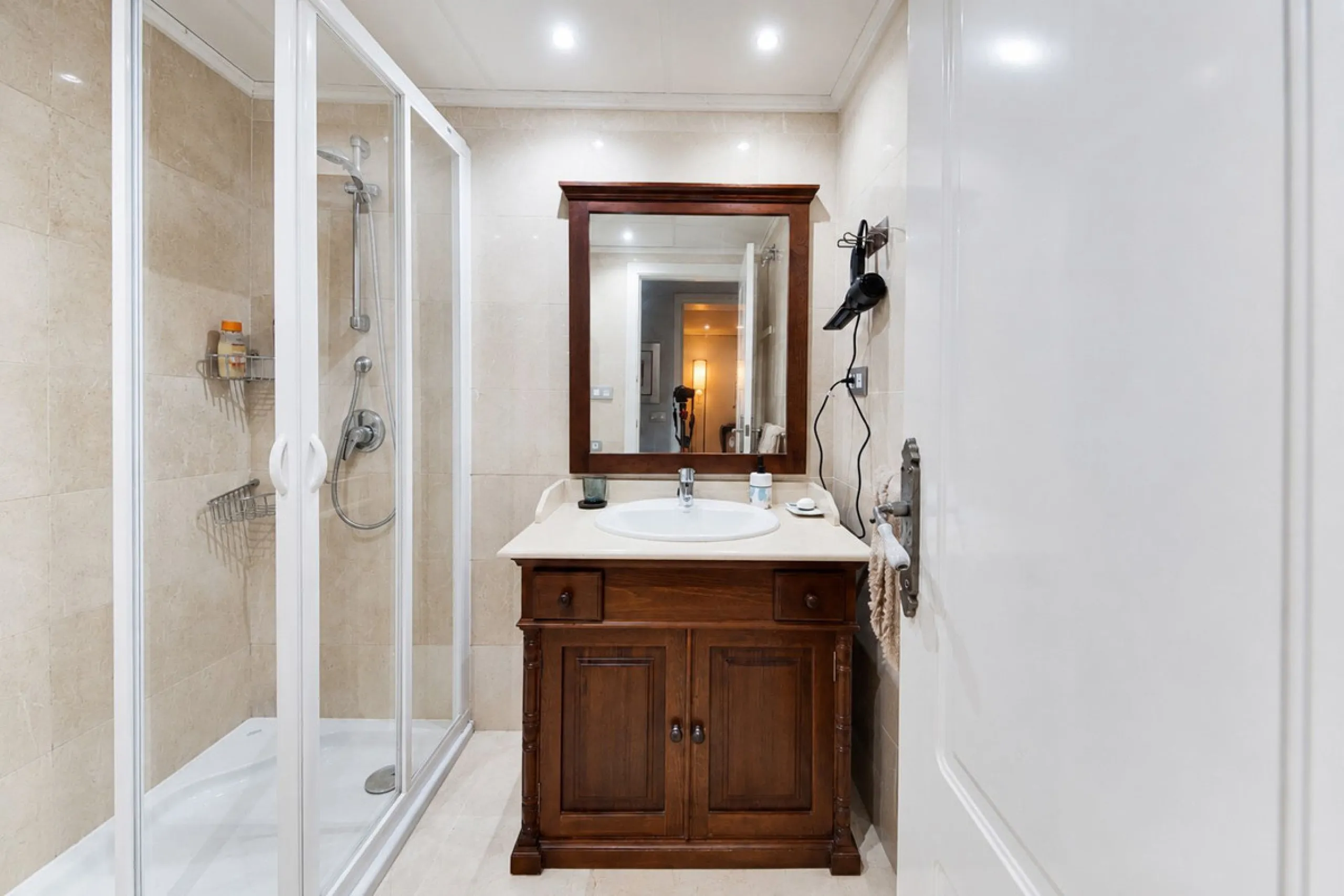 Ground floor apartment with private garden, open views, and 4 communal swimming pools.