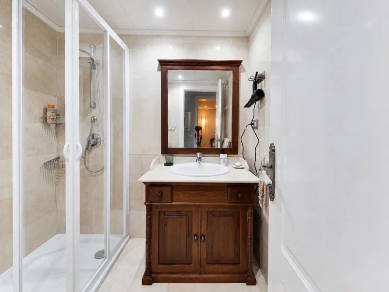 Ground floor apartment with private garden, open views, and 4 communal swimming pools.