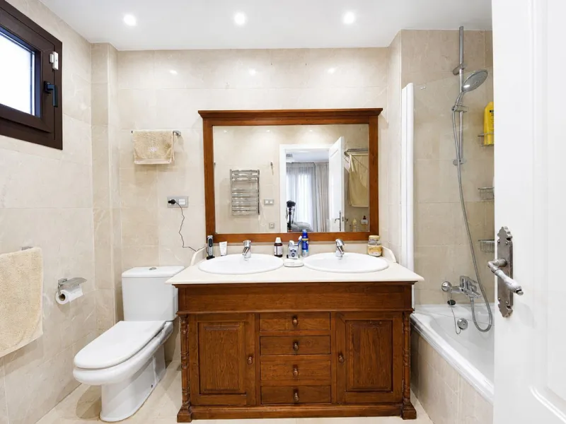 Ground floor apartment with private garden, open views, and 4 communal swimming pools.