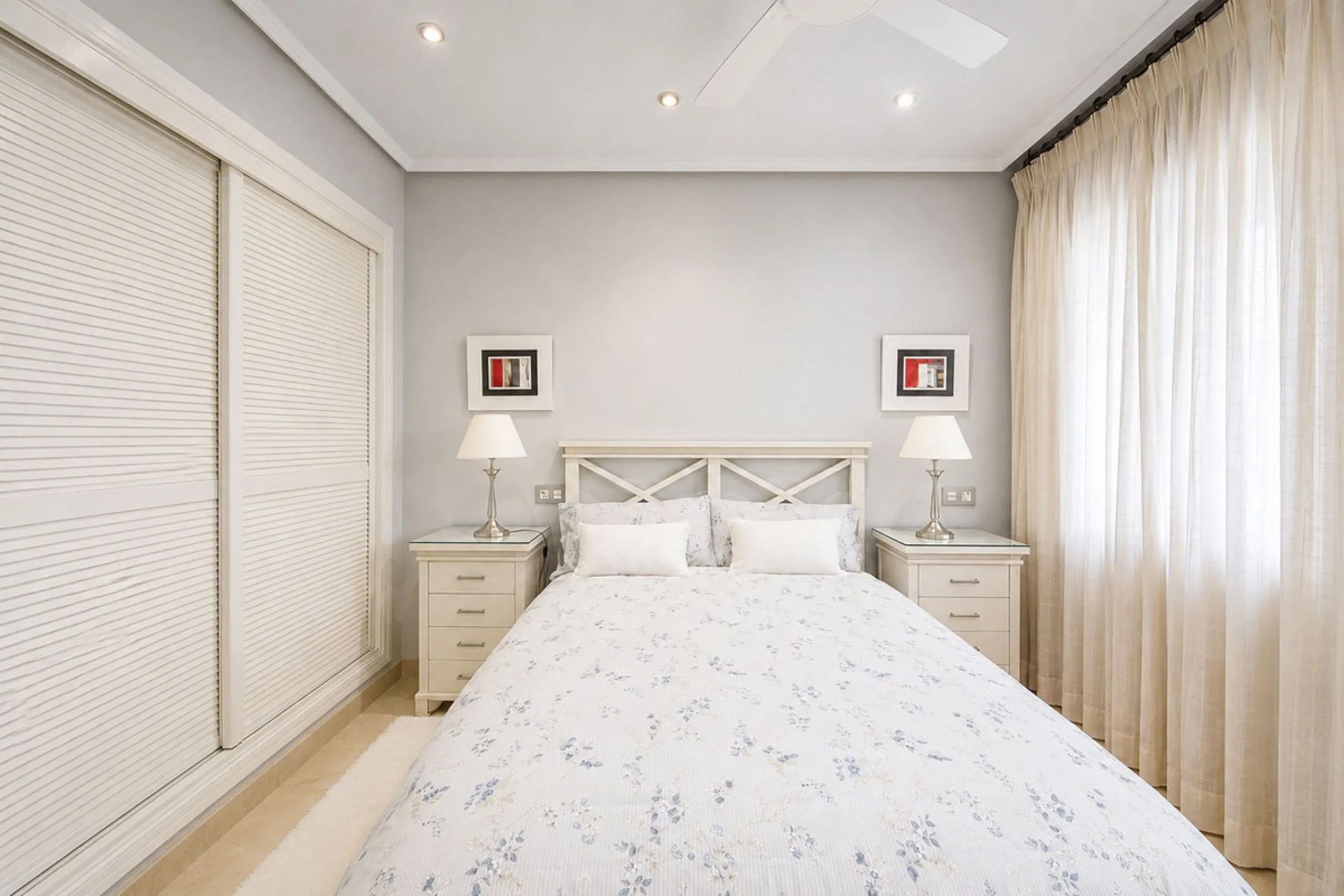 Ground floor apartment with private garden, open views, and 4 communal swimming pools.