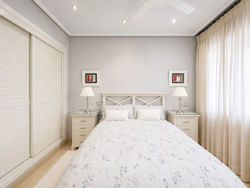 Ground floor apartment with private garden, open views, and 4 communal swimming pools.