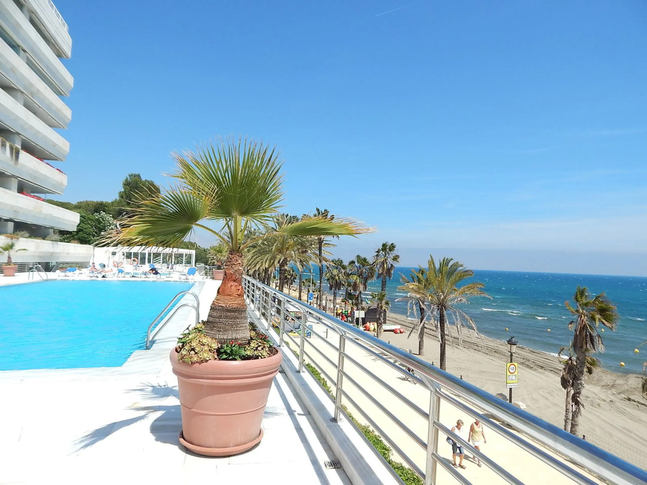 A unique opportunity to acquire a luxurious apartment in the coveted frontline beach of Marbella! This exclusive second-floor apartment in the Marina Mariola Building offers a stunning frontal view of the Mediterranean Sea. It comprises 2 spacious bedroom