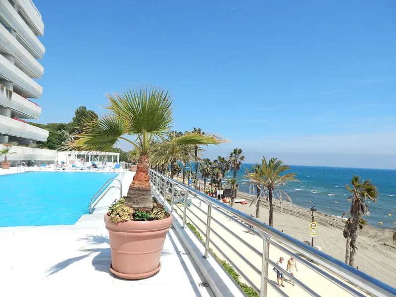 A unique opportunity to acquire a luxurious apartment in the coveted frontline beach of Marbella! This exclusive second-floor apartment in the Marina Mariola Building offers a stunning frontal view of the Mediterranean Sea. It comprises 2 spacious bedroom
