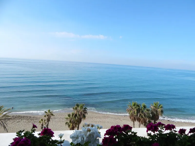 A unique opportunity to acquire a luxurious apartment in the coveted frontline beach of Marbella! This exclusive second-floor apartment in the Marina Mariola Building offers a stunning frontal view of the Mediterranean Sea. It comprises 2 spacious bedroom