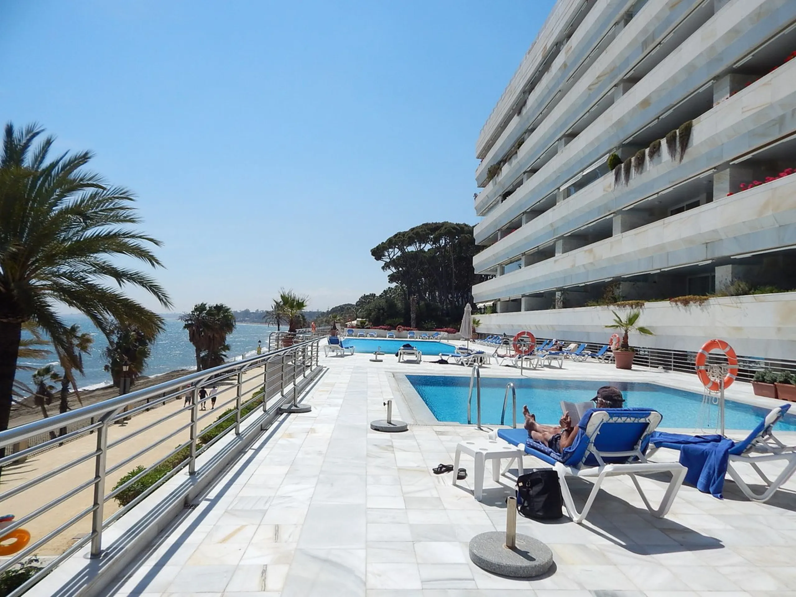 A unique opportunity to acquire a luxurious apartment in the coveted frontline beach of Marbella! This exclusive second-floor apartment in the Marina Mariola Building offers a stunning frontal view of the Mediterranean Sea. It comprises 2 spacious bedroom