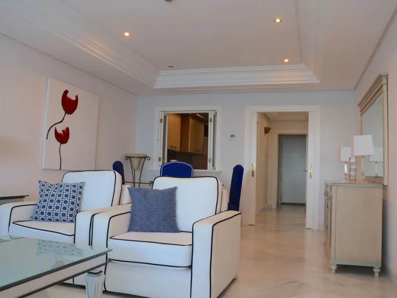 A unique opportunity to acquire a luxurious apartment in the coveted frontline beach of Marbella! This exclusive second-floor apartment in the Marina Mariola Building offers a stunning frontal view of the Mediterranean Sea. It comprises 2 spacious bedroom