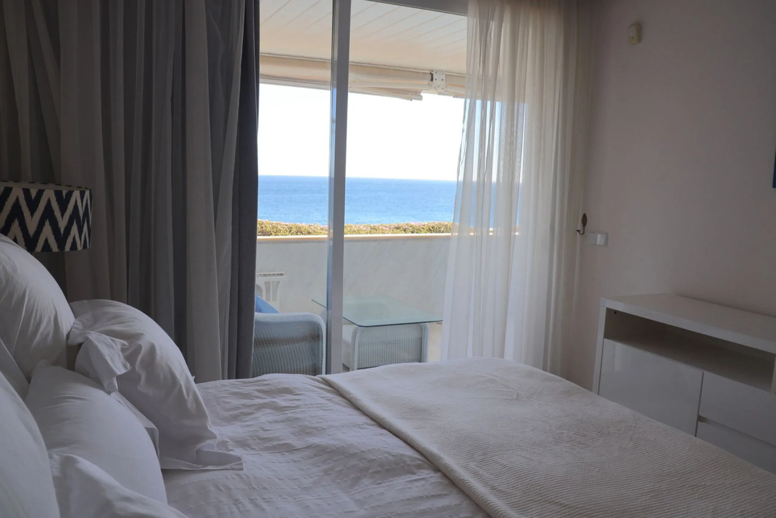 A unique opportunity to acquire a luxurious apartment in the coveted frontline beach of Marbella! This exclusive second-floor apartment in the Marina Mariola Building offers a stunning frontal view of the Mediterranean Sea. It comprises 2 spacious bedroom