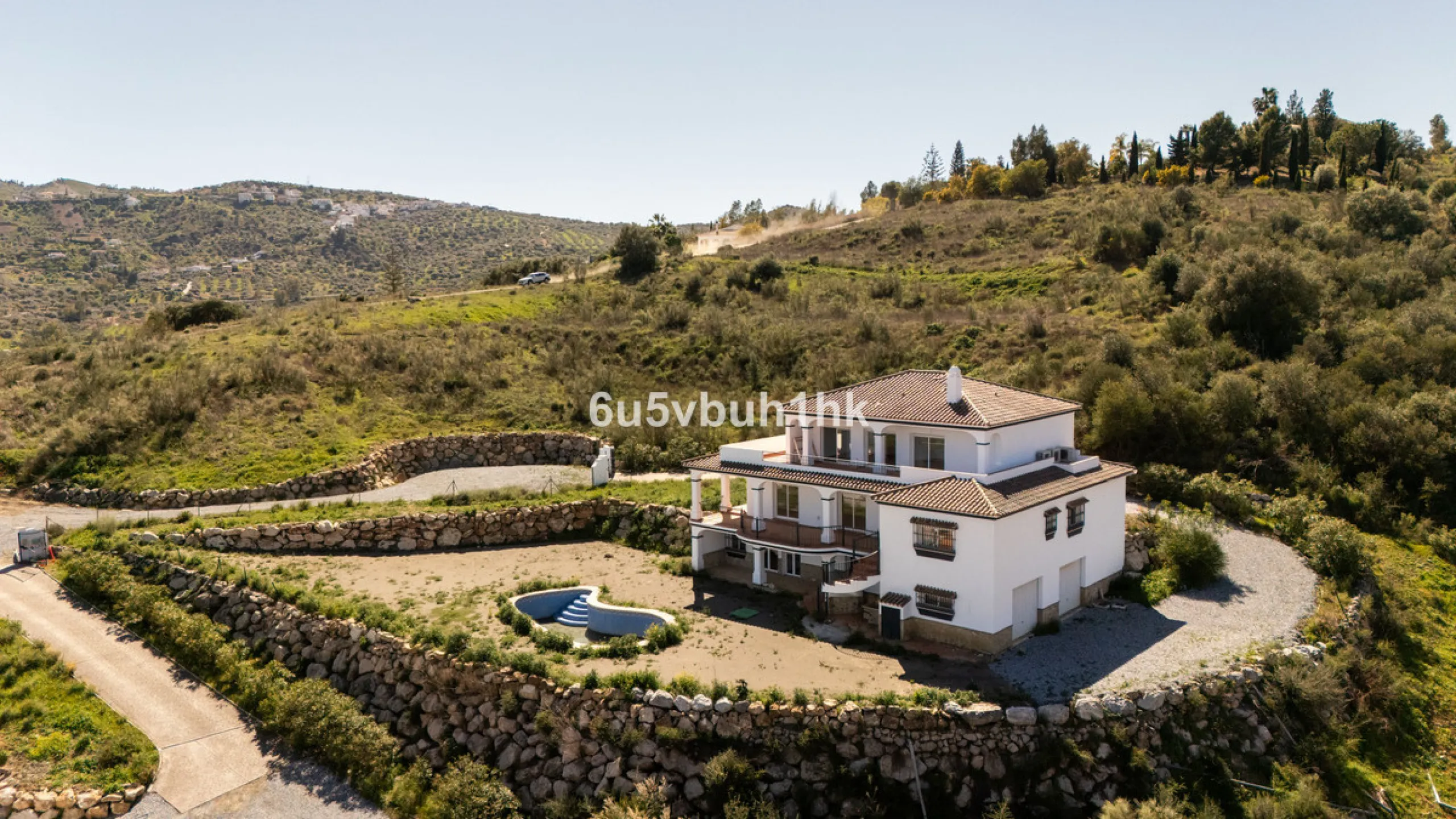 Some houses have a view. This one has a lake at its feet and a mountain range as its frame.