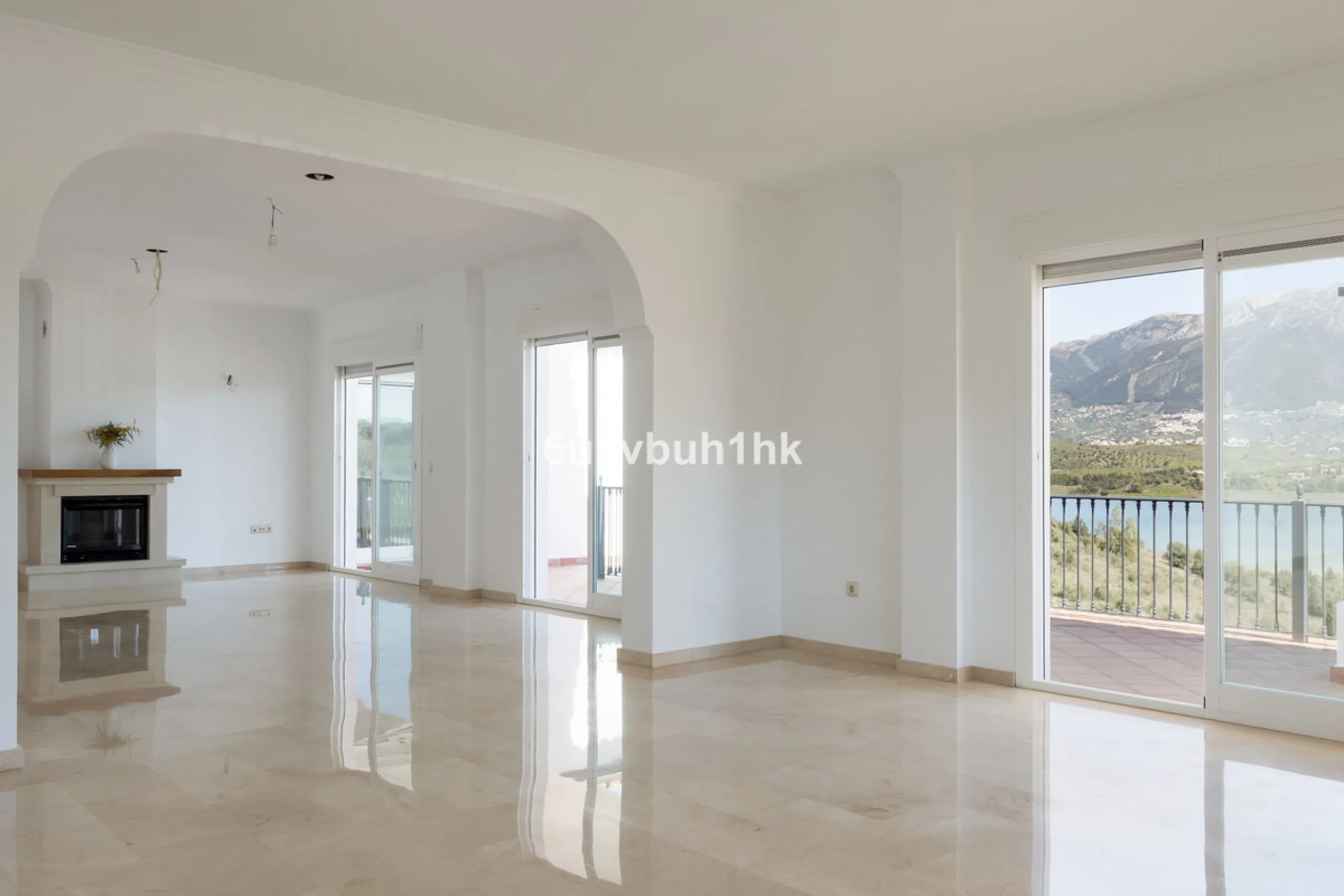 Some houses have a view. This one has a lake at its feet and a mountain range as its frame.