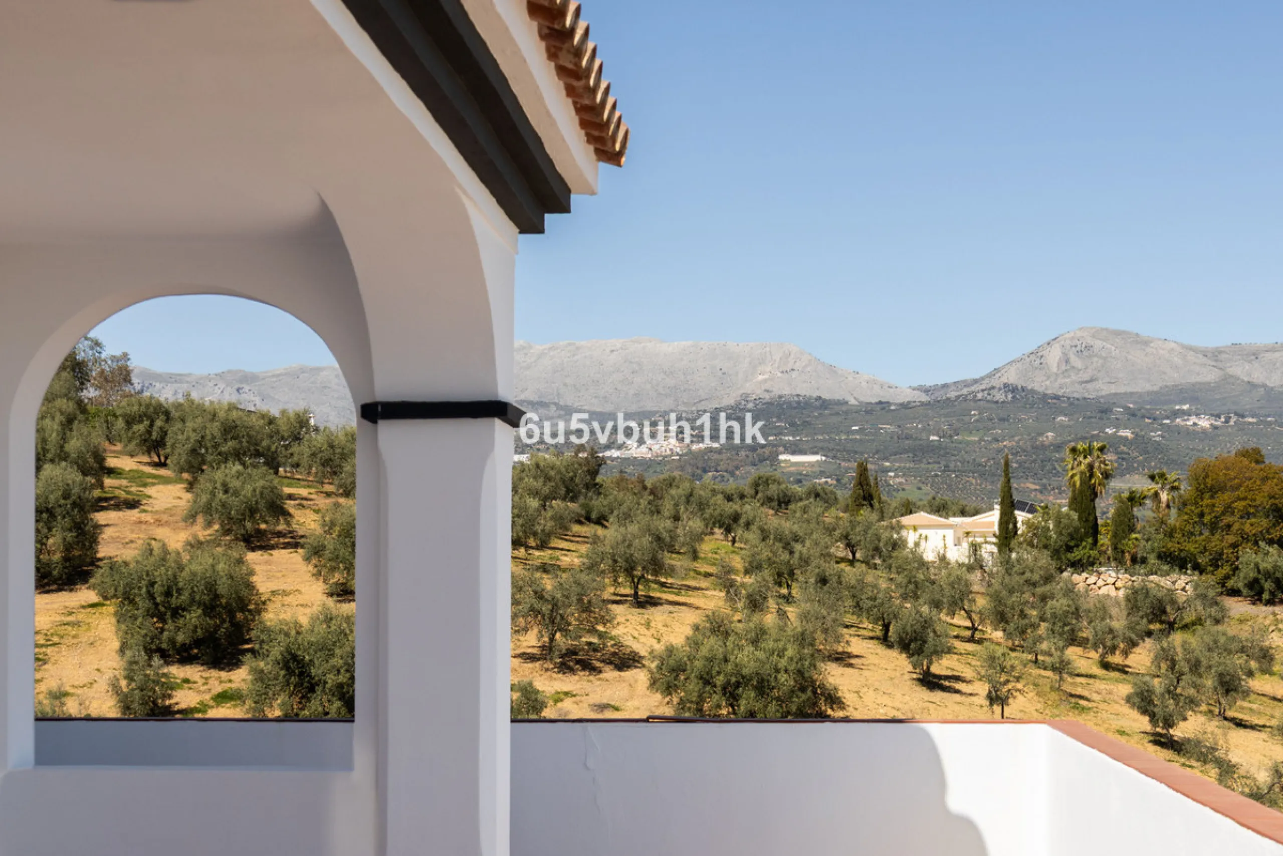 Some houses have a view. This one has a lake at its feet and a mountain range as its frame.