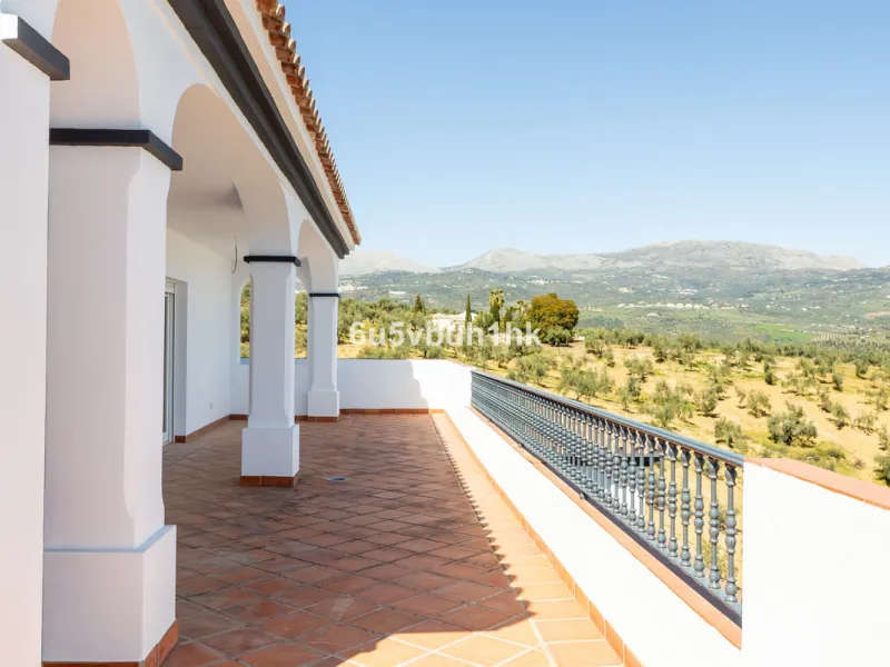 Some houses have a view. This one has a lake at its feet and a mountain range as its frame.