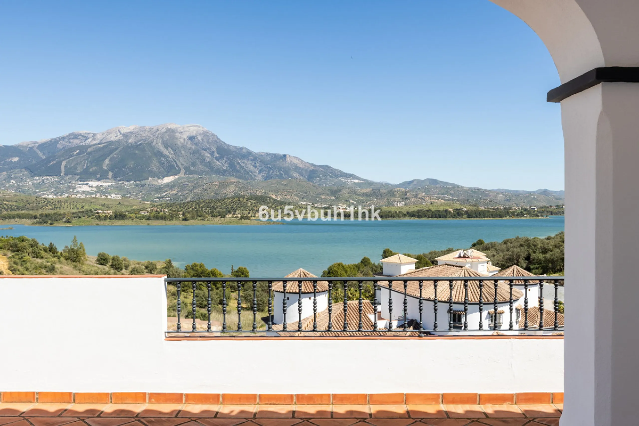 Some houses have a view. This one has a lake at its feet and a mountain range as its frame.
