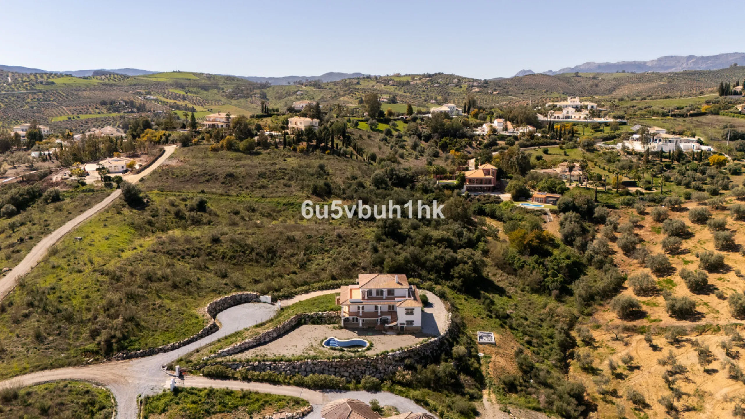 Some houses have a view. This one has a lake at its feet and a mountain range as its frame.