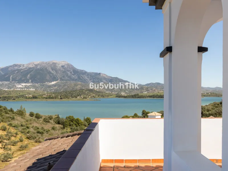 Some houses have a view. This one has a lake at its feet and a mountain range as its frame.