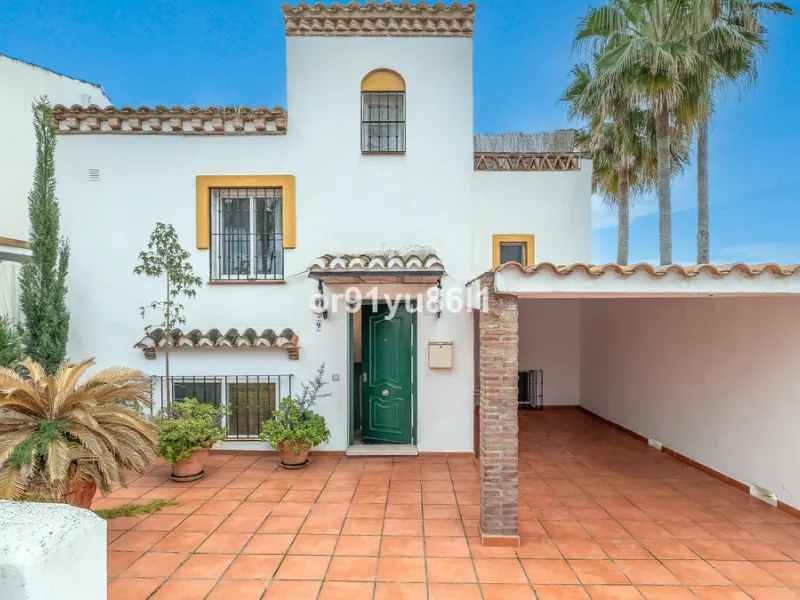 Townhouse Close to the Beach in Costabella Located within a gated, secure community in Costabella, just a short stroll from the beach, this three-bedroom, two-bathroom townhouse features a bright, spacious interior comprising a cosy living room with firep