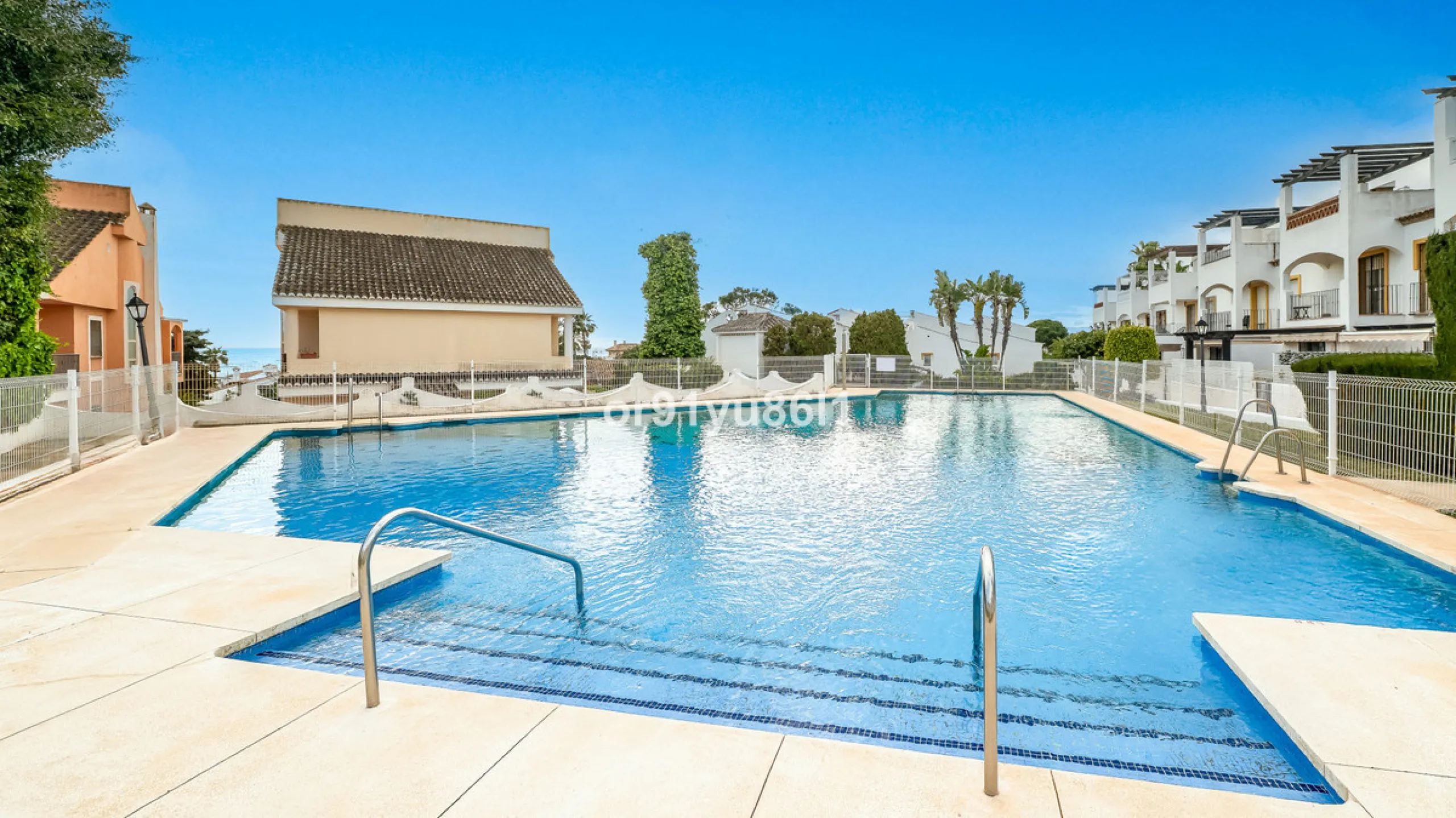 Townhouse Close to the Beach in Costabella Located within a gated, secure community in Costabella, just a short stroll from the beach, this three-bedroom, two-bathroom townhouse features a bright, spacious interior comprising a cosy living room with firep