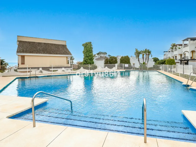 Townhouse Close to the Beach in Costabella Located within a gated, secure community in Costabella, just a short stroll from the beach, this three-bedroom, two-bathroom townhouse features a bright, spacious interior comprising a cosy living room with firep
