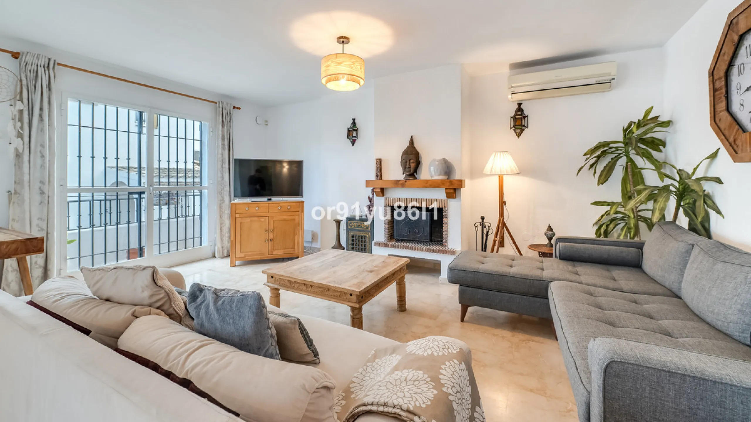 Townhouse Close to the Beach in Costabella Located within a gated, secure community in Costabella, just a short stroll from the beach, this three-bedroom, two-bathroom townhouse features a bright, spacious interior comprising a cosy living room with firep
