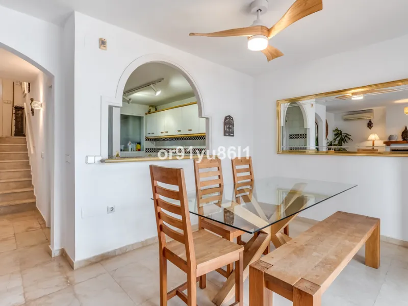Townhouse Close to the Beach in Costabella Located within a gated, secure community in Costabella, just a short stroll from the beach, this three-bedroom, two-bathroom townhouse features a bright, spacious interior comprising a cosy living room with firep