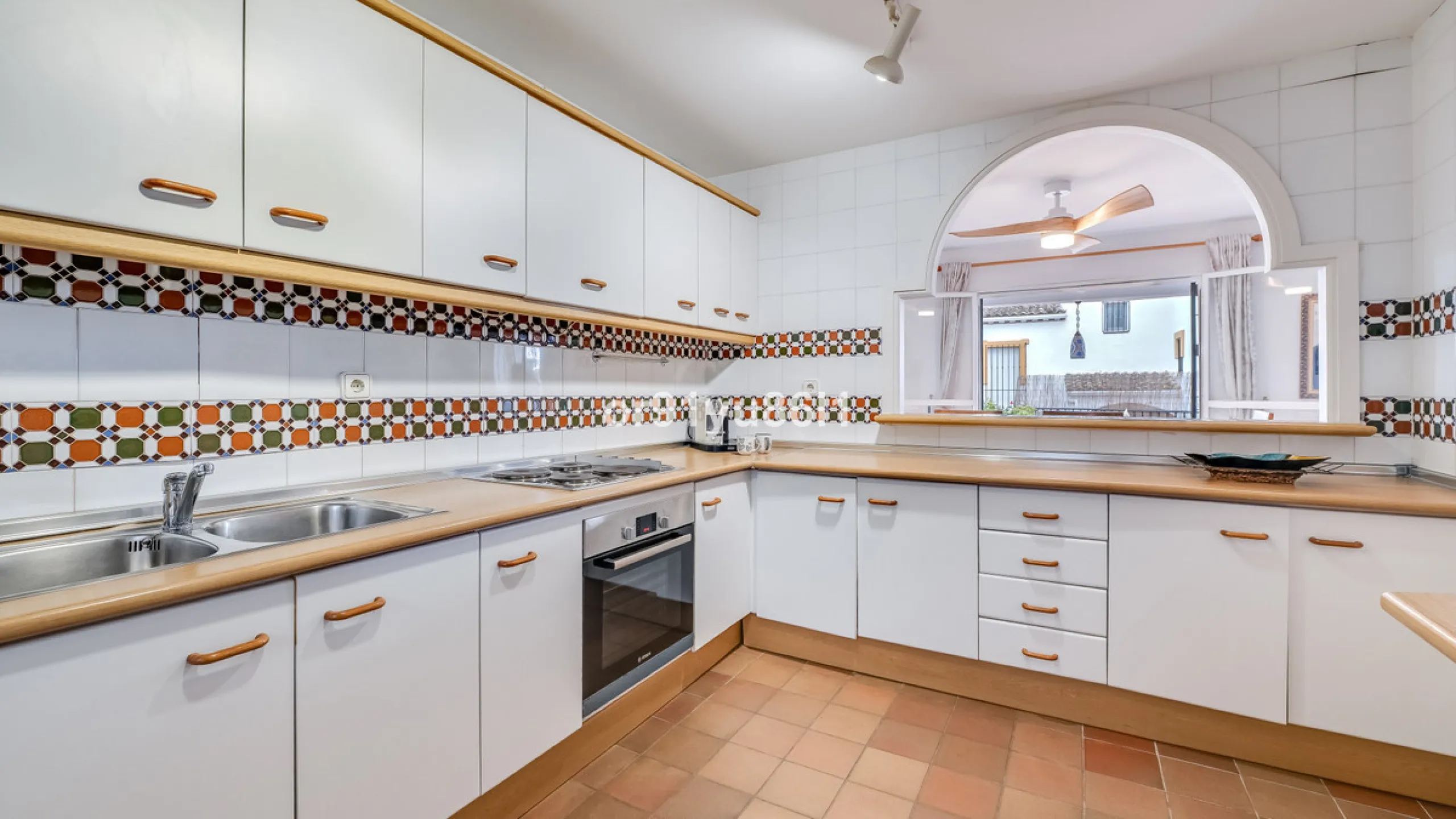 Townhouse Close to the Beach in Costabella Located within a gated, secure community in Costabella, just a short stroll from the beach, this three-bedroom, two-bathroom townhouse features a bright, spacious interior comprising a cosy living room with firep