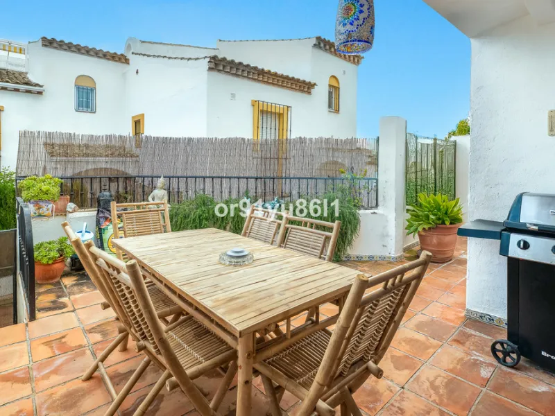 Townhouse Close to the Beach in Costabella Located within a gated, secure community in Costabella, just a short stroll from the beach, this three-bedroom, two-bathroom townhouse features a bright, spacious interior comprising a cosy living room with firep