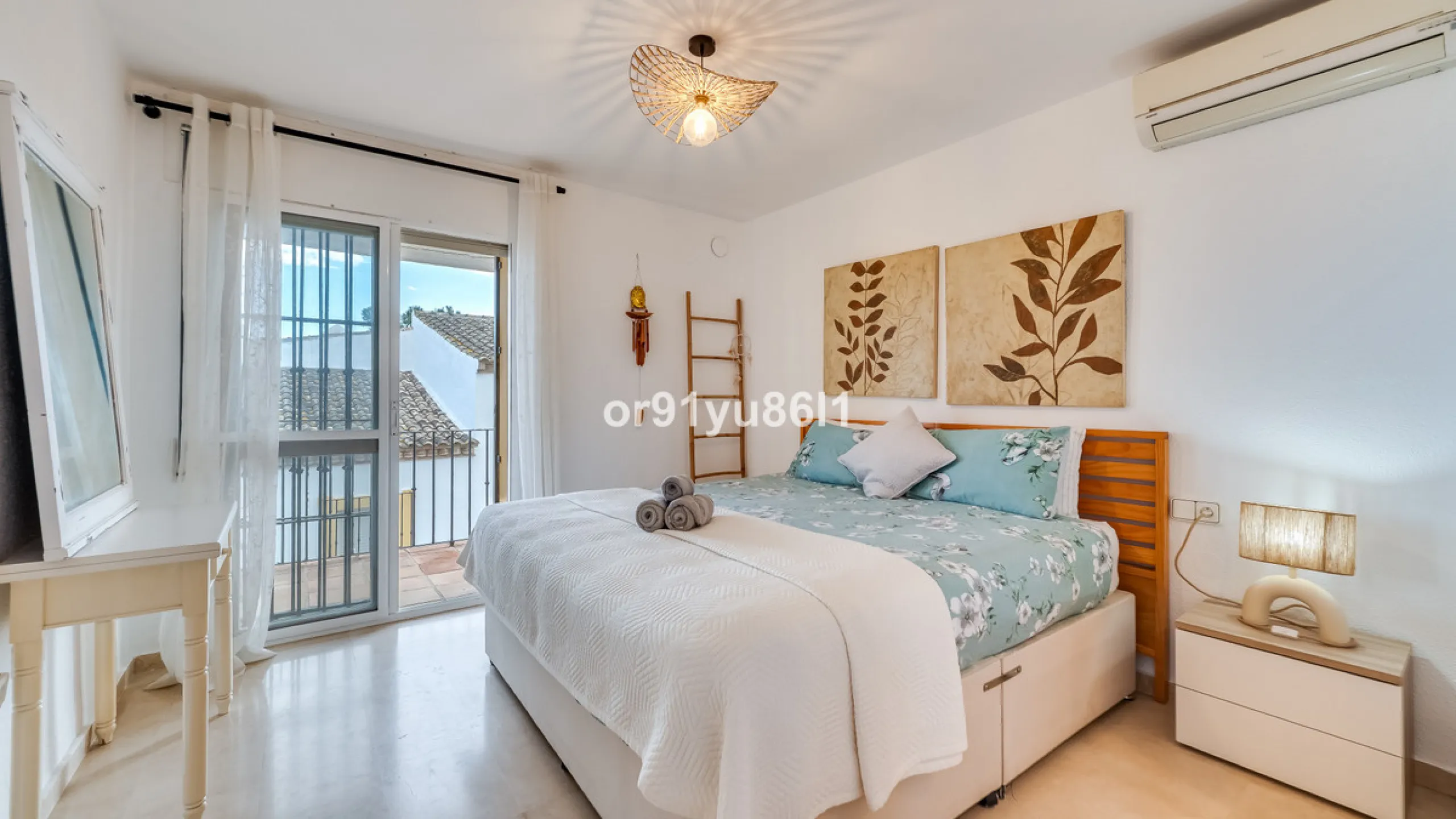 Townhouse Close to the Beach in Costabella Located within a gated, secure community in Costabella, just a short stroll from the beach, this three-bedroom, two-bathroom townhouse features a bright, spacious interior comprising a cosy living room with firep