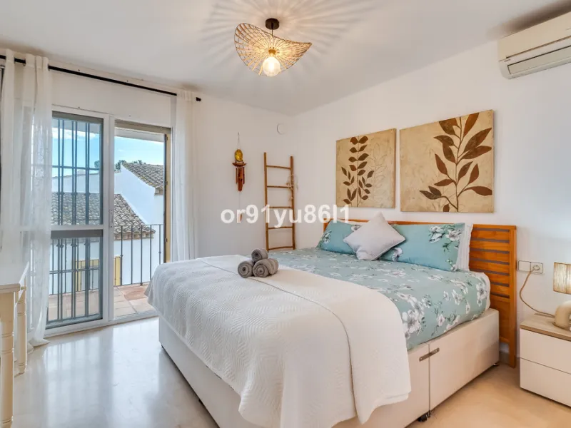 Townhouse Close to the Beach in Costabella Located within a gated, secure community in Costabella, just a short stroll from the beach, this three-bedroom, two-bathroom townhouse features a bright, spacious interior comprising a cosy living room with firep