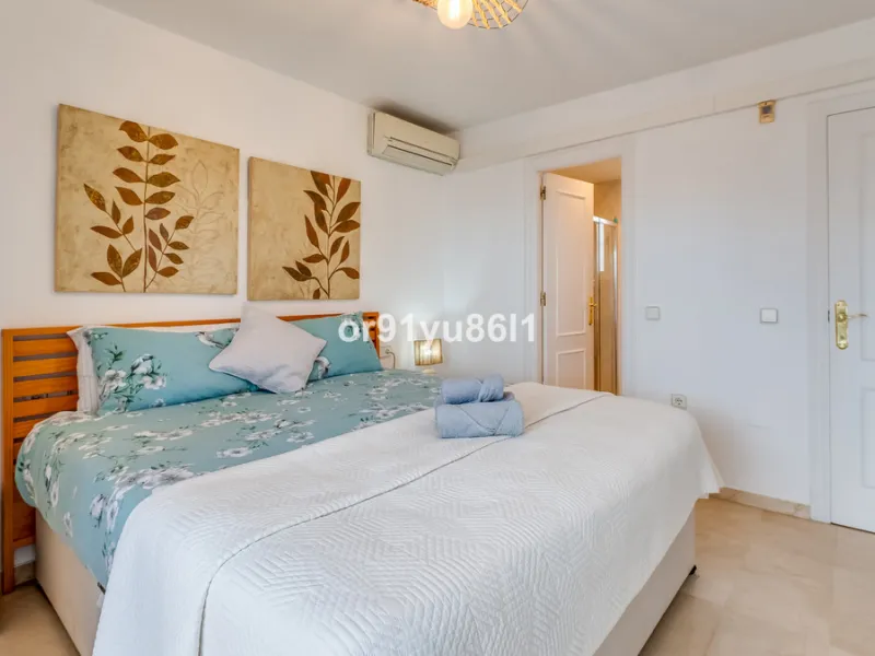 Townhouse Close to the Beach in Costabella Located within a gated, secure community in Costabella, just a short stroll from the beach, this three-bedroom, two-bathroom townhouse features a bright, spacious interior comprising a cosy living room with firep