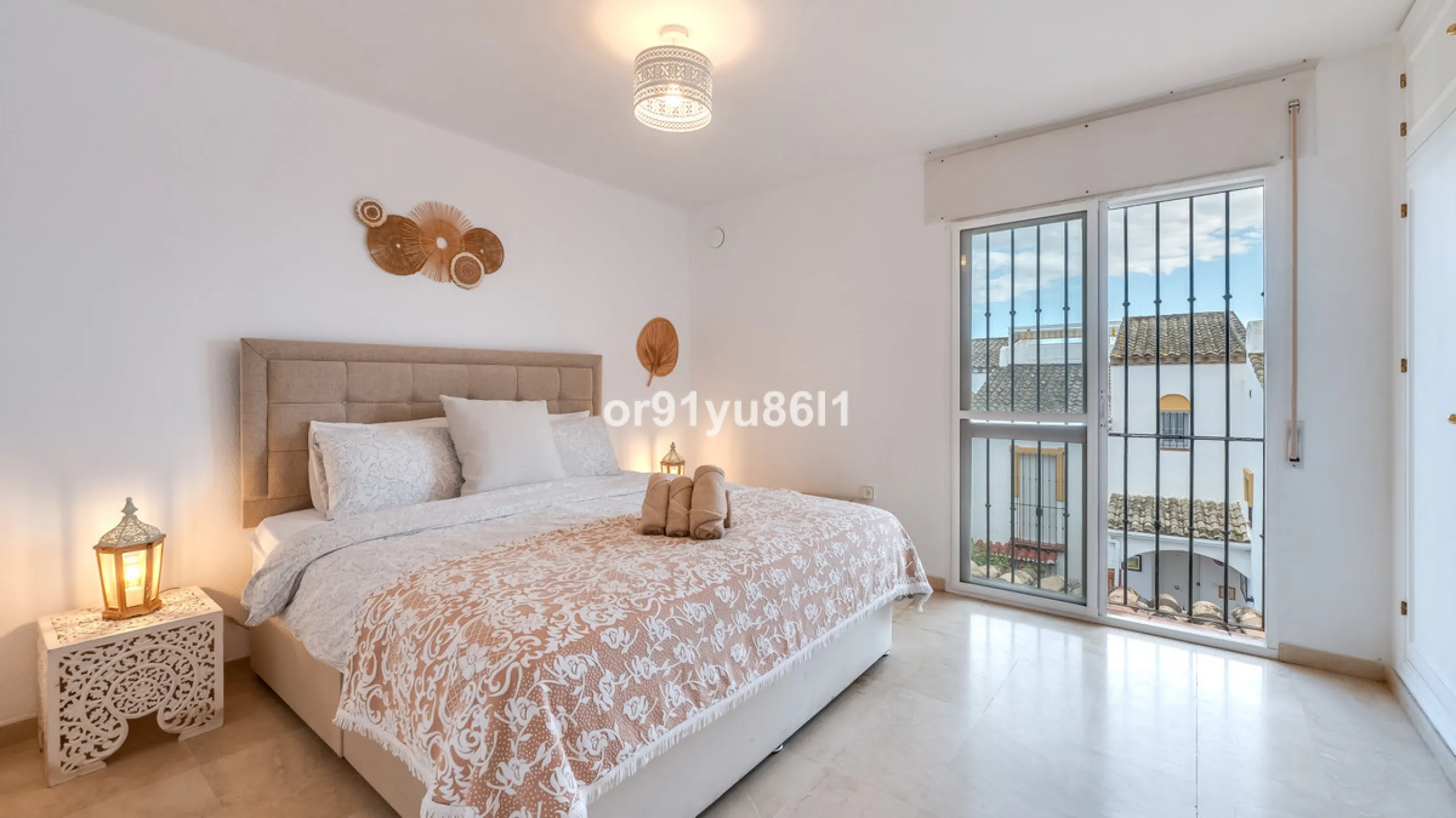 Townhouse Close to the Beach in Costabella Located within a gated, secure community in Costabella, just a short stroll from the beach, this three-bedroom, two-bathroom townhouse features a bright, spacious interior comprising a cosy living room with firep