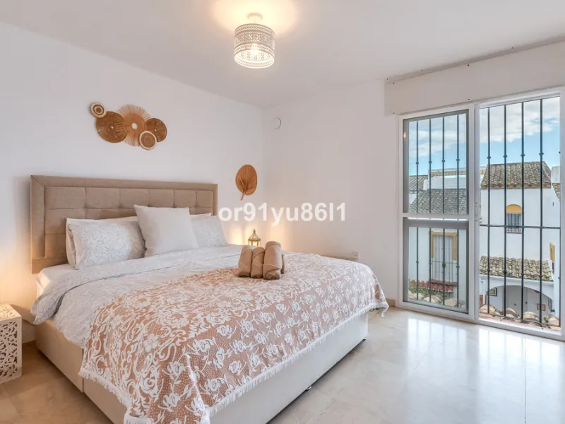 Townhouse Close to the Beach in Costabella Located within a gated, secure community in Costabella, just a short stroll from the beach, this three-bedroom, two-bathroom townhouse features a bright, spacious interior comprising a cosy living room with firep