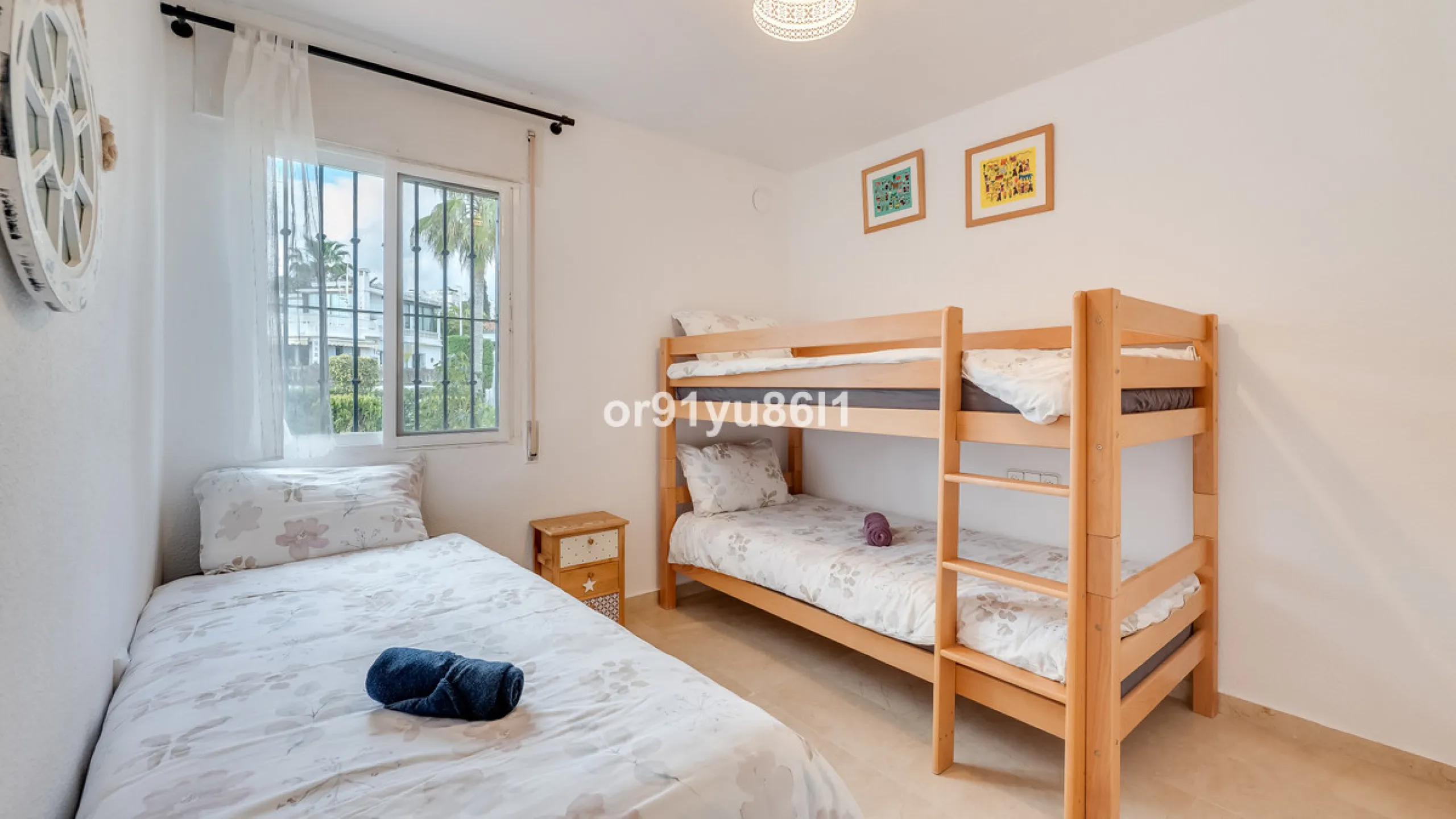 Townhouse Close to the Beach in Costabella Located within a gated, secure community in Costabella, just a short stroll from the beach, this three-bedroom, two-bathroom townhouse features a bright, spacious interior comprising a cosy living room with firep