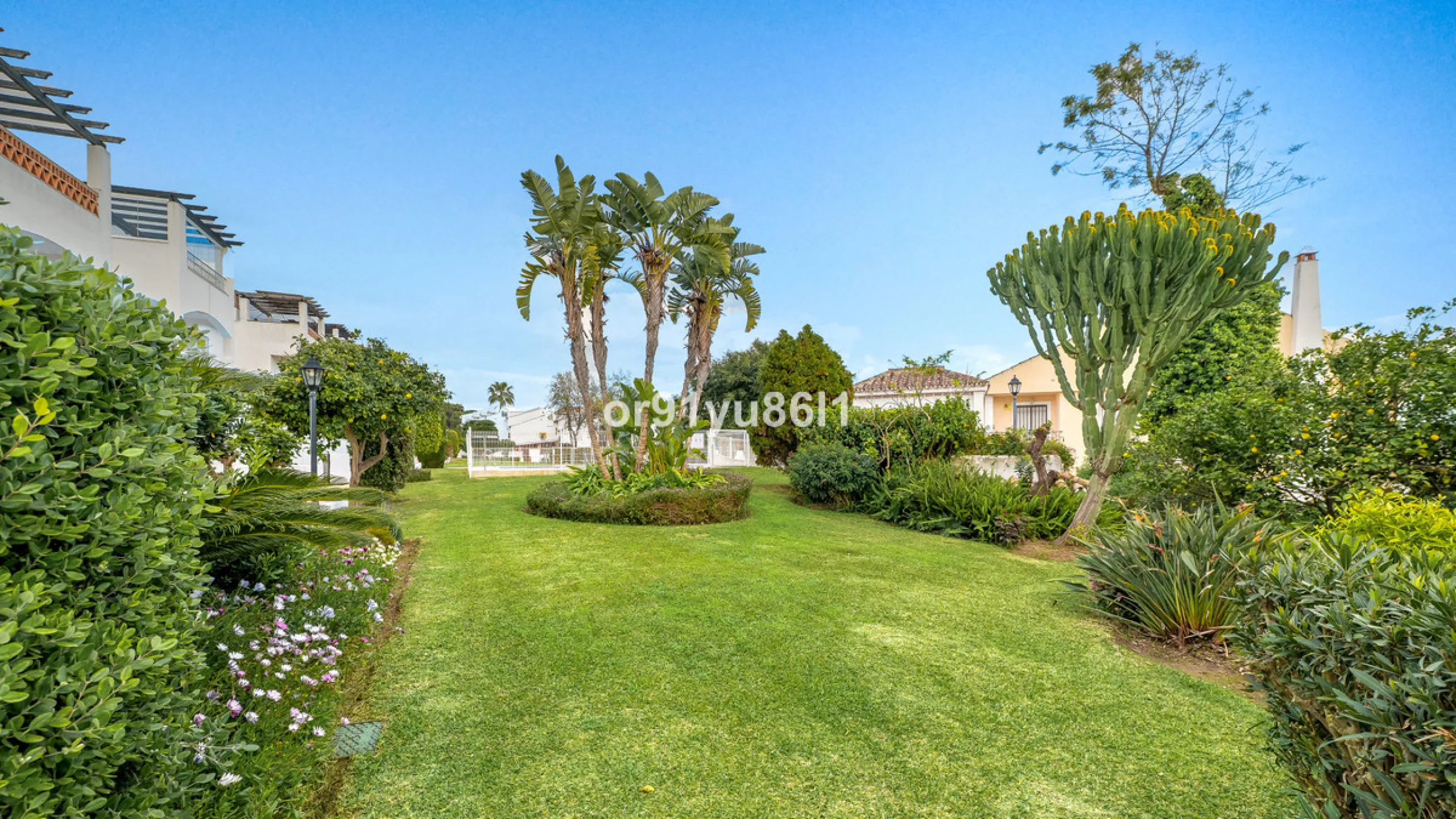 Townhouse Close to the Beach in Costabella Located within a gated, secure community in Costabella, just a short stroll from the beach, this three-bedroom, two-bathroom townhouse features a bright, spacious interior comprising a cosy living room with firep