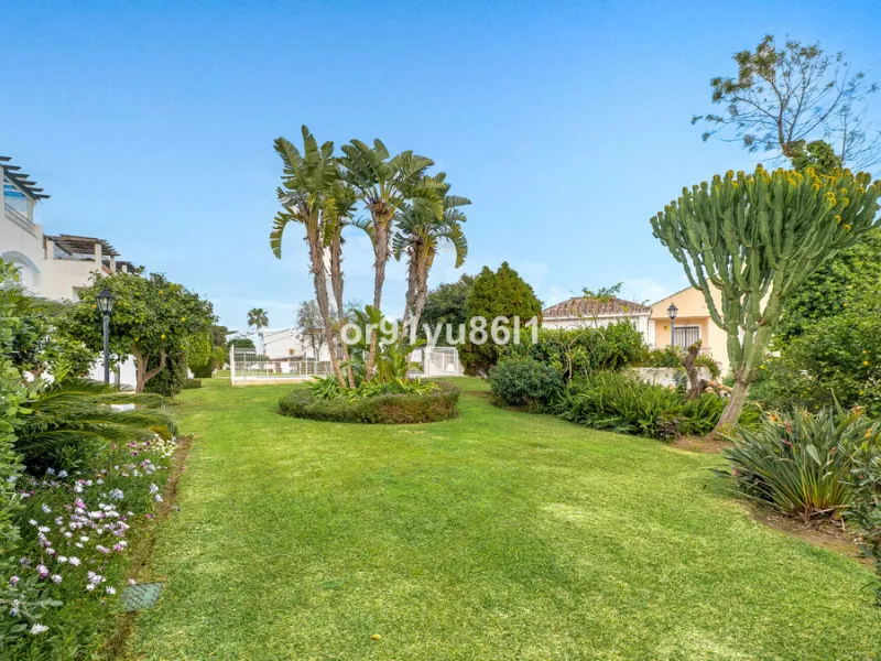 Townhouse Close to the Beach in Costabella Located within a gated, secure community in Costabella, just a short stroll from the beach, this three-bedroom, two-bathroom townhouse features a bright, spacious interior comprising a cosy living room with firep