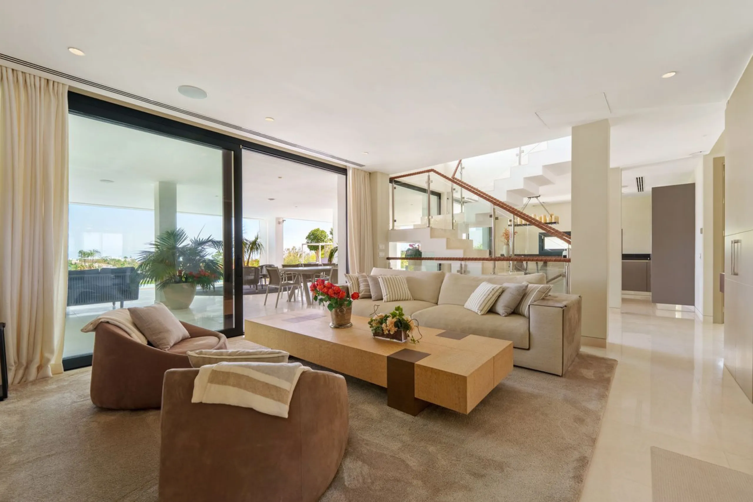 A striking contemporary villa in the heart of Nueva Andalucía, enjoying a privileged frontline golf position. With clean architectural lines, expansive terraces, and floor-to-ceiling windows, this home is designed to maximize natural light and uninterrupt