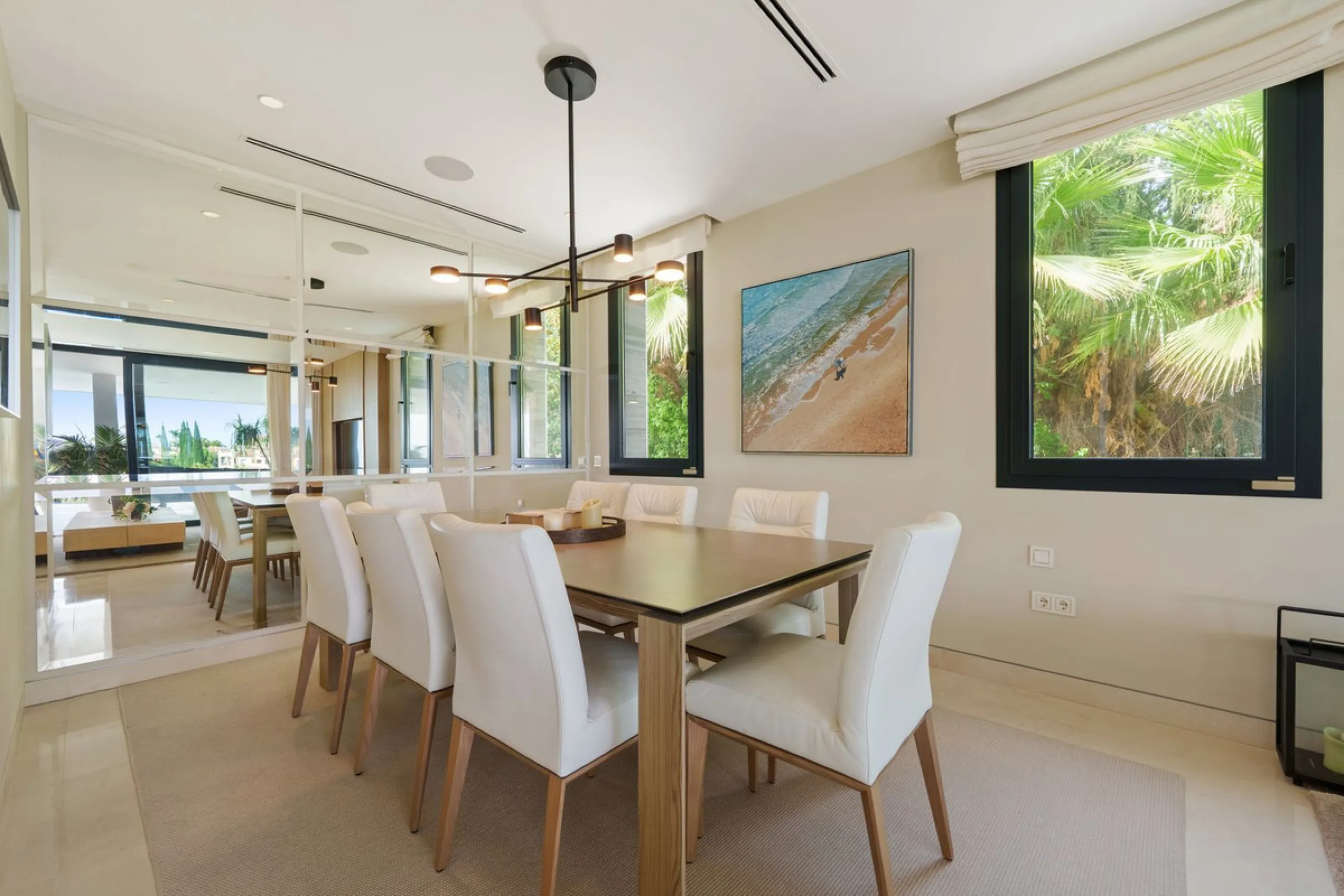 A striking contemporary villa in the heart of Nueva Andalucía, enjoying a privileged frontline golf position. With clean architectural lines, expansive terraces, and floor-to-ceiling windows, this home is designed to maximize natural light and uninterrupt