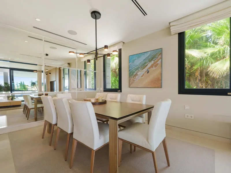 A striking contemporary villa in the heart of Nueva Andalucía, enjoying a privileged frontline golf position. With clean architectural lines, expansive terraces, and floor-to-ceiling windows, this home is designed to maximize natural light and uninterrupt