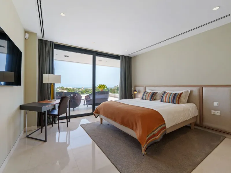 A striking contemporary villa in the heart of Nueva Andalucía, enjoying a privileged frontline golf position. With clean architectural lines, expansive terraces, and floor-to-ceiling windows, this home is designed to maximize natural light and uninterrupt