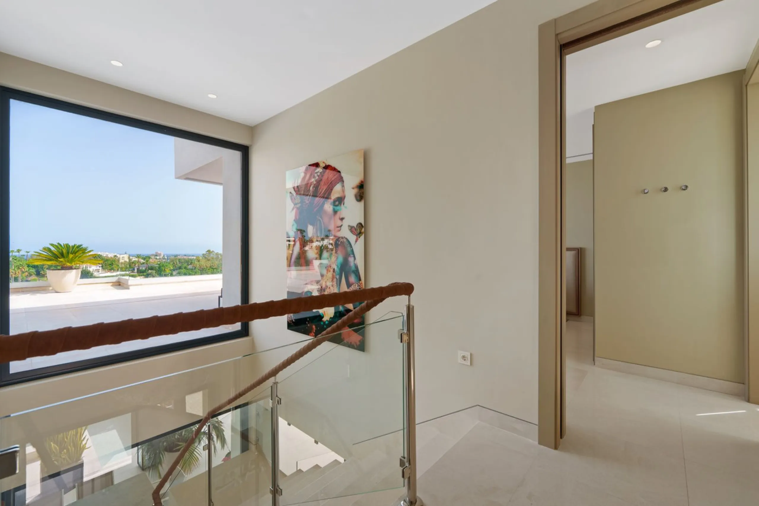 A striking contemporary villa in the heart of Nueva Andalucía, enjoying a privileged frontline golf position. With clean architectural lines, expansive terraces, and floor-to-ceiling windows, this home is designed to maximize natural light and uninterrupt