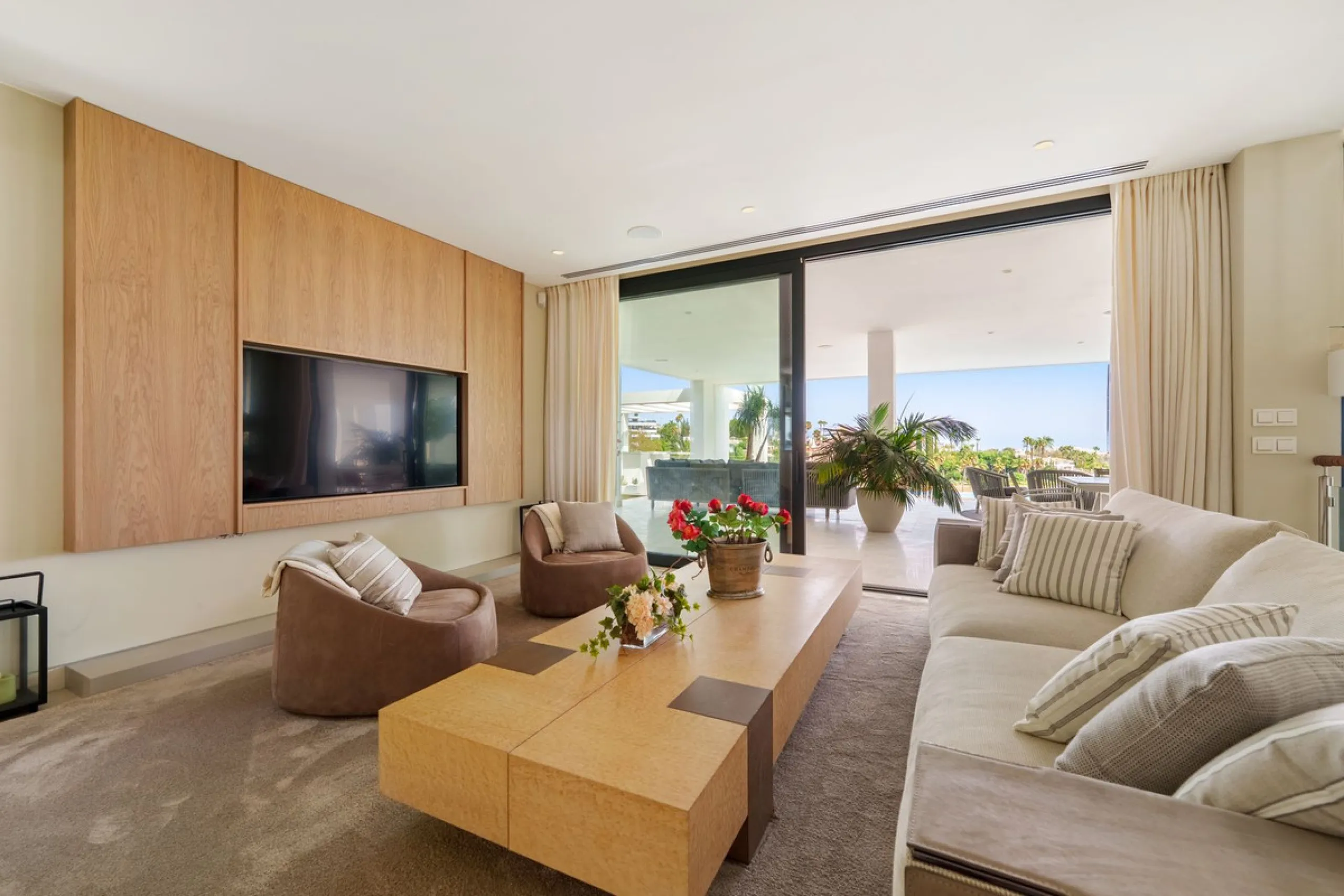 A striking contemporary villa in the heart of Nueva Andalucía, enjoying a privileged frontline golf position. With clean architectural lines, expansive terraces, and floor-to-ceiling windows, this home is designed to maximize natural light and uninterrupt