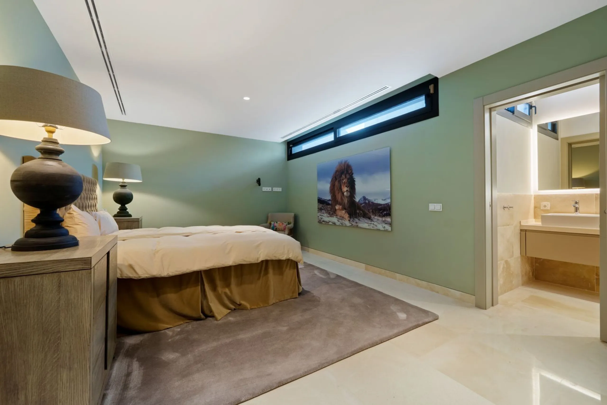 A striking contemporary villa in the heart of Nueva Andalucía, enjoying a privileged frontline golf position. With clean architectural lines, expansive terraces, and floor-to-ceiling windows, this home is designed to maximize natural light and uninterrupt